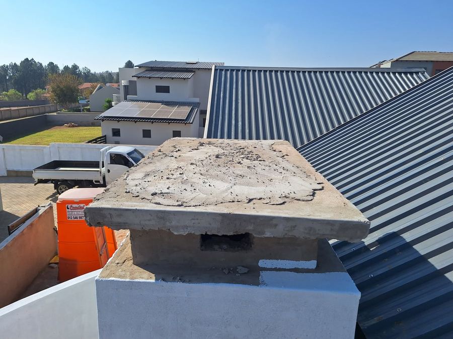 Waterproofed chimney capping on a flat torch-on roof in Pretoria