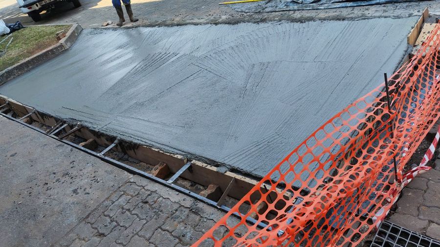 Freshly poured and finished concrete slab foundation on site in Rosslyn, Pretoria